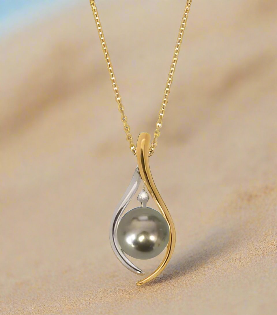 Black South Sea Pearl on an 18K Yellow and White Gold Fitting